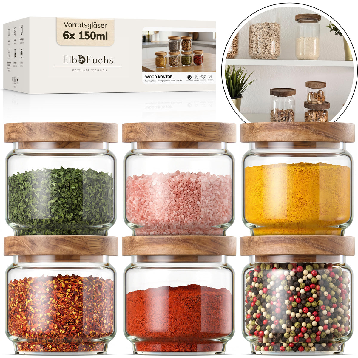 Eine ElbFuchs Verpackung der Gewürzgläser 6x 150ml Serie WOOD KONTOR steht neben sechs runden Gläsern mit Olivenholzdeckel, gefüllt mit getrockneten Kräutern, rosa Salz, Kurkuma, Chiliflocken, Paprikapulver und bunten Pfefferkörnern; ein runder Bildausschnitt zeigt die Gläser im Küchenregal.