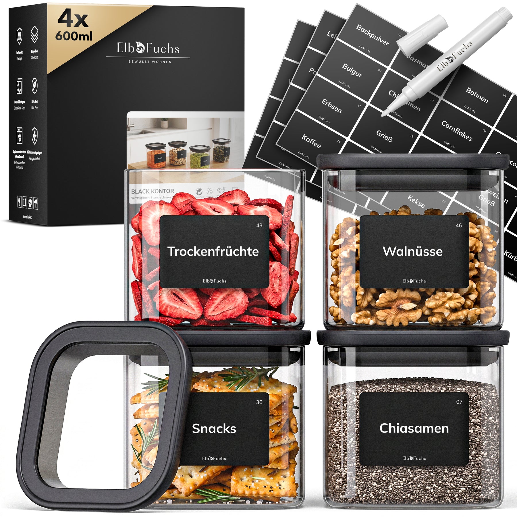 Vier ElbFuchs BLACK KONTOR Vorratsgläser à 600 ml mit schwarzem Deckel, gefüllt mit Trockenfrüchten, Walnüssen, Snacks und Chiasamen, inklusive Etiketten und Kreidestift.
