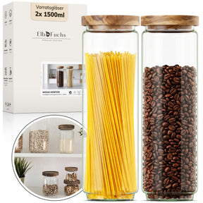 Die ElbFuchs Verpackung 'Vorratsgläser 2x 1500 ml Wood Kontor' steht neben zwei hohen Gläsern mit Olivenholzdeckel, eines randvoll mit langen Spaghetti, das andere mit Kaffeebohnen gefüllt.