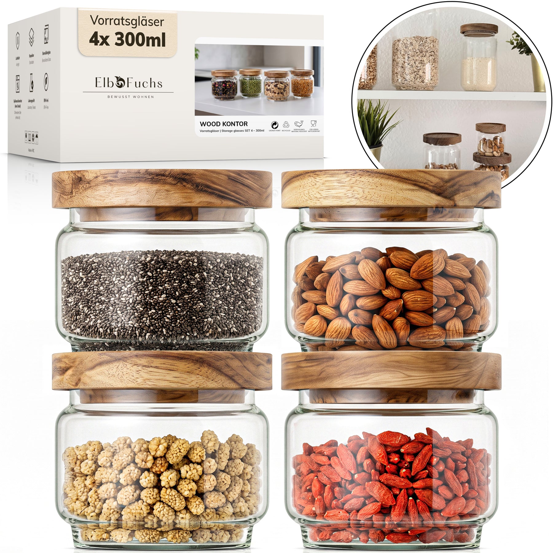 Die ElbFuchs Verpackung der Vorratsgläser 4x 300ml Serie WOOD KONTOR steht neben vier quadratischen Gläsern mit Deckeln aus Olivenholz, gefüllt mit Chiasamen, Mandeln, getrockneten Maulbeeren und Gojibeeren; ein runder Bildausschnitt zeigt die Gläser griffbereit im Küchenregal.